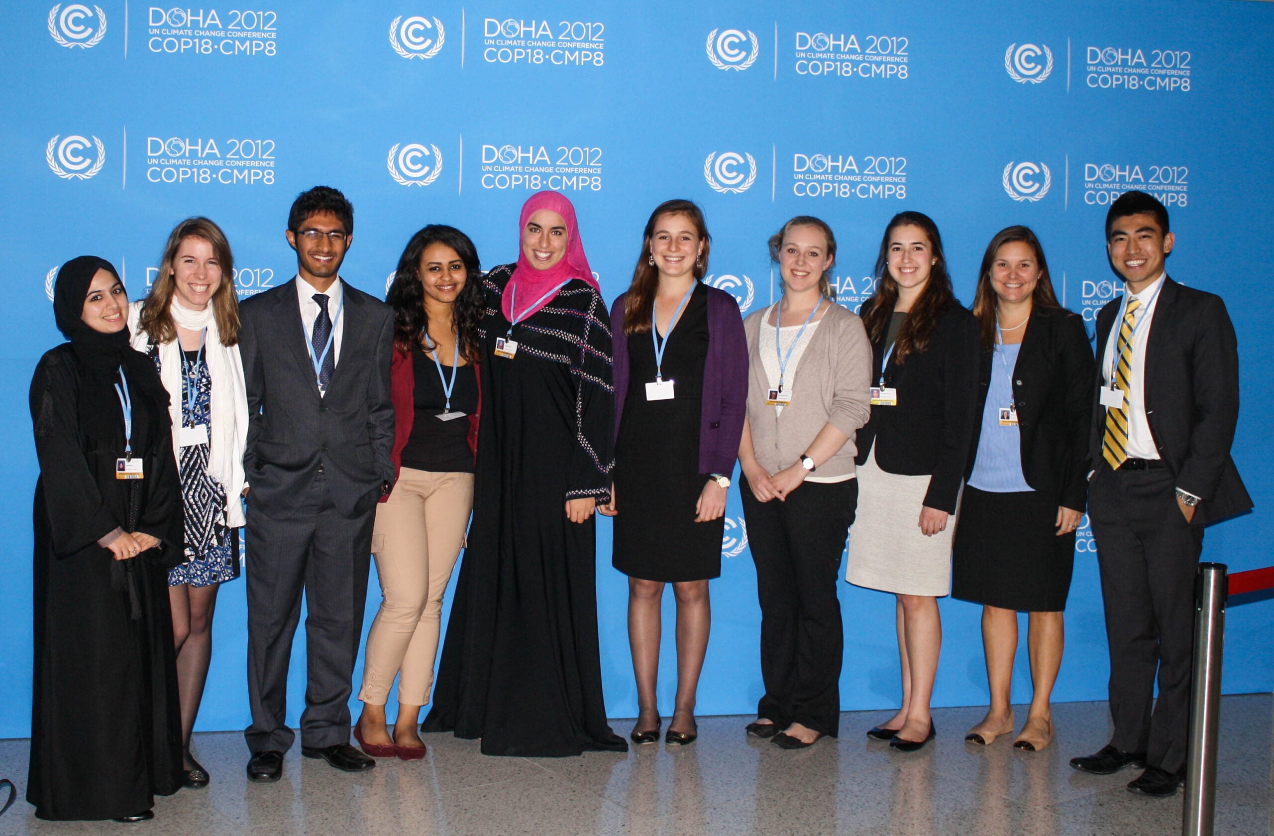 Picture of Dr. Lewis at COP19 with a delegation of 8 students.