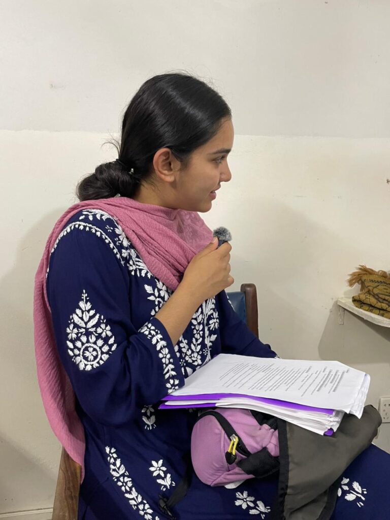 Amara holding a microphone